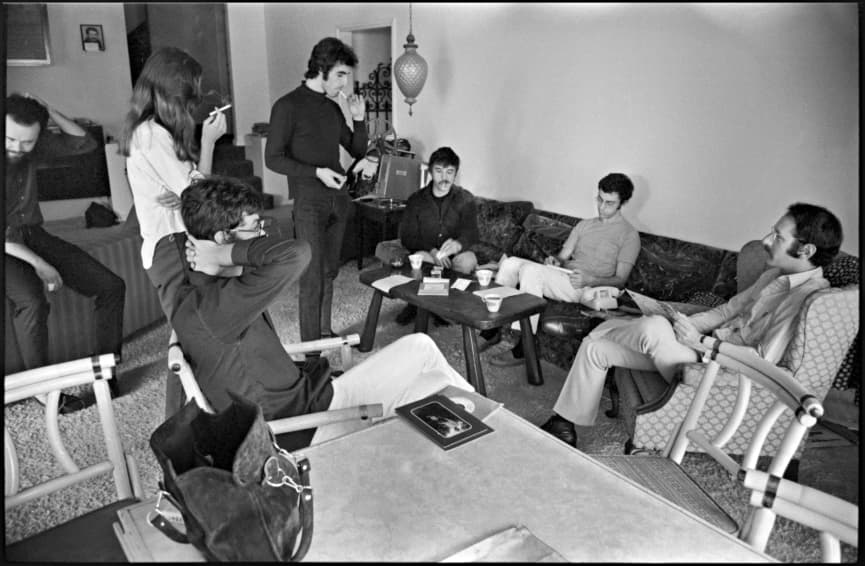 1969. A moment of reflection during the making of The Band's 2nd album in LA. Garth, scratching his head, Richard's wife Jane and Richard, smoking, Rick and me on the couch, Robbie in the foreground and visiting guest Peter Yarrow in the comfortable "Guest's Chair".
