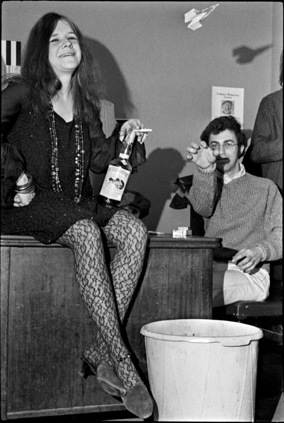 1968. Janis, her bottle, me, my paper airplane. Apparently not a very productive moment.