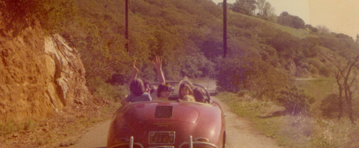 1976. A trip to California to rehearse for The Last Waltz concert. Rick Danko giving his kids and ours a ride in his Porsche. A good time was had by all.